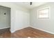 Bright bedroom with hardwood floors, large closet, and neutral walls at 408 N Sherwood Dr, Muncie, IN 47304