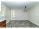 Simple dining room with hardwood floors and a chandelier at 408 N Sherwood Dr, Muncie, IN 47304