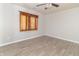 Bedroom with ceiling fan, window with sheer curtains, and hardwood floors at 408 N Sherwood Dr, Muncie, IN 47304