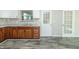 Updated kitchen with wood cabinets, stainless steel appliances and granite countertops at 408 N Sherwood Dr, Muncie, IN 47304