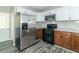 Modern kitchen with stainless steel appliances and granite countertops at 408 N Sherwood Dr, Muncie, IN 47304