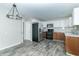 Updated kitchen featuring stainless steel appliances and wood cabinets at 408 N Sherwood Dr, Muncie, IN 47304