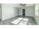 Spacious living room featuring gray vinyl plank flooring at 408 N Sherwood Dr, Muncie, IN 47304