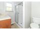 Clean bathroom with shower, vanity, and toilet at 408 N Sherwood Dr, Muncie, IN 47304