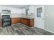 Renovated kitchen with wood cabinets, granite countertops and stainless steel appliances at 408 N Sherwood Dr, Muncie, IN 47304