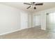 Bedroom with ceiling fan, mirrored closet doors, and hardwood floors at 408 N Sherwood Dr, Muncie, IN 47304