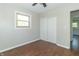 Bedroom with ceiling fan, double door closet and hardwood floors at 408 N Sherwood Dr, Muncie, IN 47304