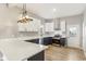L-shaped kitchen with white and blue cabinets and quartz countertops at 819 Cottage Ave, Indianapolis, IN 46203
