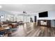 Spacious living room with hardwood floors and a large TV at 120 Walnut St, Southport, IN 46227