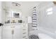 Clean bathroom with white vanity and black accents at 1306 S Talbott St, Indianapolis, IN 46225
