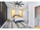 Cozy bedroom with gray bed and yellow accents at 1306 S Talbott St, Indianapolis, IN 46225