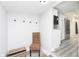 Small entryway with coat hooks and bench seating at 1306 S Talbott St, Indianapolis, IN 46225