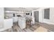 Modern kitchen with white cabinets, an island, and stainless steel appliances at 1306 S Talbott St, Indianapolis, IN 46225