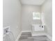 Laundry room with built-in dog washing station at 1306 S Talbott St, Indianapolis, IN 46225