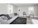 Living room with gray couch and two black accent chairs at 1306 S Talbott St, Indianapolis, IN 46225