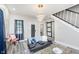 Spacious living room with a comfortable couch and natural light at 1306 S Talbott St, Indianapolis, IN 46225