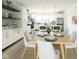 Eat-in kitchen with white cabinets and a large island at 1310 Colere Pl, Indianapolis, IN 46203
