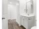 Modern bathroom with white vanity and a large mirror at 1452 Coen Ct, Columbus, IN 47201