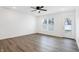 Spacious living room with vinyl plank flooring and door to patio at 1452 Coen Ct, Columbus, IN 47201