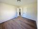 Bright bedroom with hardwood floors and access to bathroom at 1714 S Goodlet Ave, Indianapolis, IN 46241