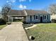 Charming ranch home with carport and landscaped lawn at 1714 S Goodlet Ave, Indianapolis, IN 46241
