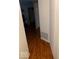 Long hallway with hardwood floors leading to other rooms at 4112 Eagle Cove E Dr, Indianapolis, IN 46254