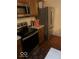 Kitchen with stainless steel appliances and wood cabinets at 4112 Eagle Cove E Dr, Indianapolis, IN 46254