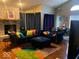 Spacious living room featuring a sectional sofa and fireplace at 4112 Eagle Cove E Dr, Indianapolis, IN 46254