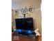 Living room with large TV and Gathering tree wall art at 4112 Eagle Cove E Dr, Indianapolis, IN 46254