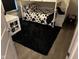 bedroom with bunk bed and black fuzzy rug at 4204 W Palomino Ct, Muncie, IN 47304