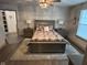 Bedroom with plush carpet, and en suite bathroom at 4204 W Palomino Ct, Muncie, IN 47304