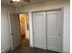 Bedroom with double doors leading to the hallway and a large closet at 4204 W Palomino Ct, Muncie, IN 47304