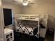bedroom with bunk bed, black rug, and window blinds at 4204 W Palomino Ct, Muncie, IN 47304