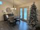 Elegant dining room with round table, four chairs, and hardwood floors at 4204 W Palomino Ct, Muncie, IN 47304