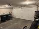 Spacious garage with white door and storage at 4204 W Palomino Ct, Muncie, IN 47304
