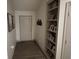 Interior hallway with built-in shelving and hardwood floors at 4204 W Palomino Ct, Muncie, IN 47304
