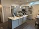 Modern kitchen with gray cabinets, quartz countertops, and stainless steel appliances at 4204 W Palomino Ct, Muncie, IN 47304