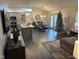 Open concept kitchen and dining area with modern finishes and hardwood floors at 4204 W Palomino Ct, Muncie, IN 47304