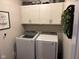 Laundry room with washer, dryer, and cabinets at 4204 W Palomino Ct, Muncie, IN 47304