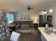 Spacious living room with L-shaped sectional sofa and hardwood floors at 4204 W Palomino Ct, Muncie, IN 47304