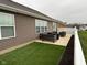 Backyard patio with seating and artificial turf at 4204 W Palomino Ct, Muncie, IN 47304