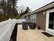 Cozy patio with seating area, adjacent to a fenced backyard at 4204 W Palomino Ct, Muncie, IN 47304