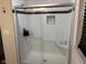 Updated shower with subway tile, glass enclosure, and built-in niche at 4204 W Palomino Ct, Muncie, IN 47304