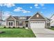 New construction home features a charming exterior with stone accents and a two-car garage at 7098 Sterling Way, Brownsburg, IN 46112