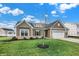 Attractive home with gray siding, stone accents, and a neatly manicured lawn at 7098 Sterling Way, Brownsburg, IN 46112