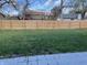 Large backyard with a wooden privacy fence at 7530 Redcliff Rd, Indianapolis, IN 46256