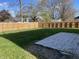 Fenced backyard with a patio and grassy area at 7530 Redcliff Rd, Indianapolis, IN 46256