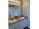Double sink bathroom vanity with a large mirror at 7530 Redcliff Rd, Indianapolis, IN 46256