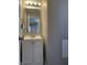 Small bathroom with vanity, mirror, and light fixture at 7530 Redcliff Rd, Indianapolis, IN 46256