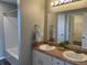 Double vanity bathroom with a shower and bathtub at 7530 Redcliff Rd, Indianapolis, IN 46256
